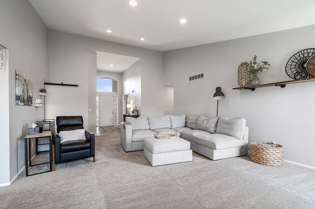 living room with recessed lighting, carpet, visible vents, and baseboards