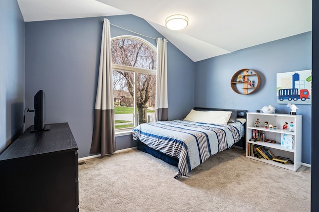 carpeted bedroom featuring vaulted ceiling and baseboards