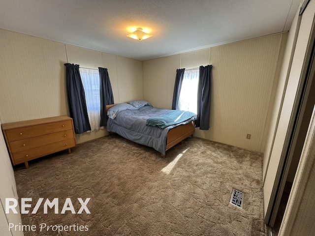 bedroom featuring visible vents and carpet flooring