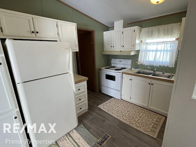 kitchen featuring white appliances, lofted ceiling, a sink, white cabinetry, and dark wood-type flooring