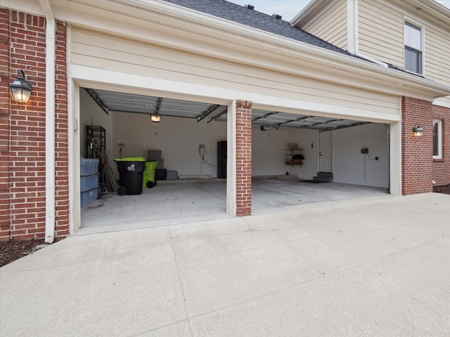 garage with concrete driveway