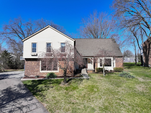 4238 Still Meadow Ln, West Bloomfield, MI 48323 - view of front of house featuring brick siding, a front yard, and driveway