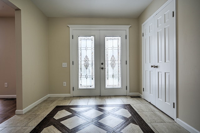 4238 Still Meadow Ln, West Bloomfield, MI 48323 - foyer entrance featuring baseboards, french doors, inlaid floor details, and plenty of natural light
