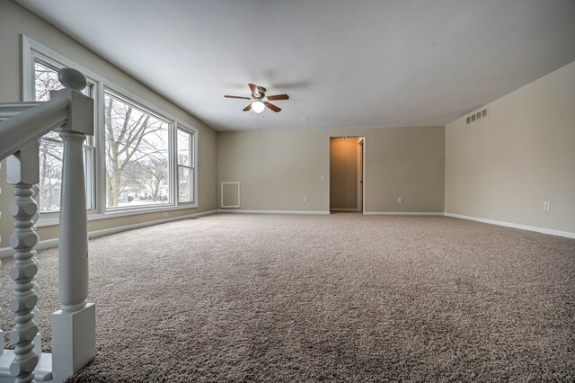 4238 Still Meadow Ln, West Bloomfield, MI 48323 - unfurnished living room featuring a ceiling fan, healthy amount of natural light, carpet flooring, and baseboards
