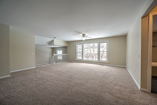 4238 Still Meadow Ln, West Bloomfield, MI 48323 - unfurnished living room featuring a ceiling fan, carpet flooring, and baseboards