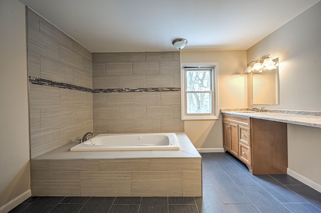4238 Still Meadow Ln, West Bloomfield, MI 48323 - bathroom featuring vanity, a bath, and baseboards