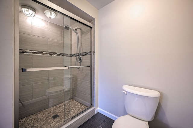 4238 Still Meadow Ln, West Bloomfield, MI 48323 - full bathroom with toilet, a stall shower, and baseboards
