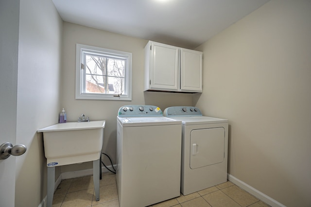 4238 Still Meadow Ln, West Bloomfield, MI 48323 - washroom with cabinet space, independent washer and dryer, baseboards, and light tile patterned floors