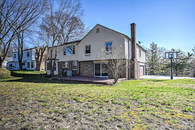 4238 Still Meadow Ln, West Bloomfield, MI 48323 - rear view of house featuring a chimney, a lawn, brick siding, and an attached garage