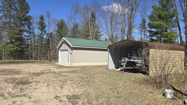 detached garage with a detached carport