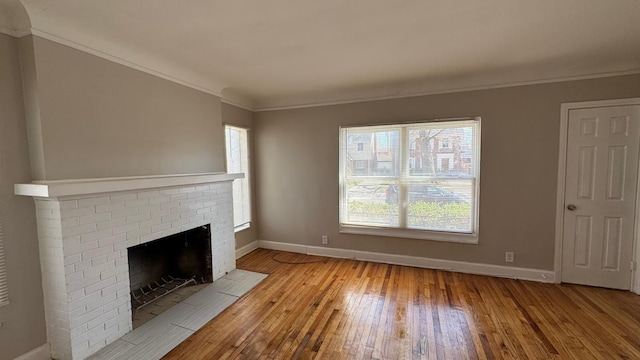 5051 Courville St, Detroit, MI 48224 - unfurnished living room featuring baseboards, a wealth of natural light, and light wood-style floors