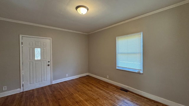 5051 Courville St, Detroit, MI 48224 - entryway featuring wood finished floors, visible vents, crown molding, and baseboards