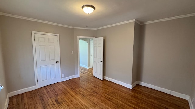 5051 Courville St, Detroit, MI 48224 - unfurnished bedroom with hardwood / wood-style floors, baseboards, and ornamental molding
