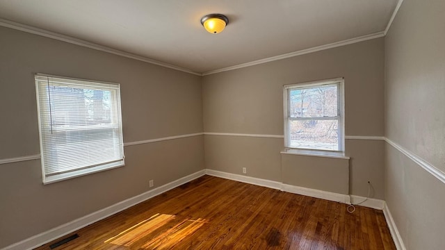 5051 Courville St, Detroit, MI 48224 - spare room featuring plenty of natural light, baseboards, dark wood-type flooring, and crown molding