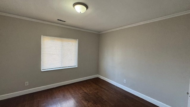 5051 Courville St, Detroit, MI 48224 - spare room featuring ornamental molding, baseboards, dark wood-style flooring, and visible vents