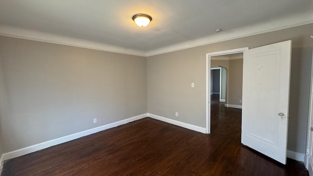 5051 Courville St, Detroit, MI 48224 - unfurnished room with dark wood-type flooring, crown molding, and baseboards