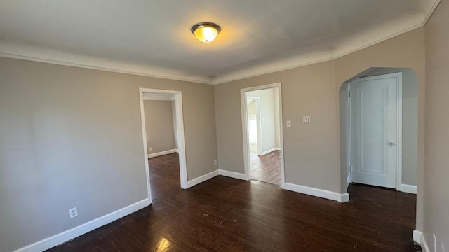 5051 Courville St, Detroit, MI 48224 - spare room with arched walkways, dark wood-style flooring, crown molding, and baseboards