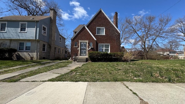 5051 Courville St, Detroit, MI 48224 - view of front of property with brick siding, a front lawn, and a chimney