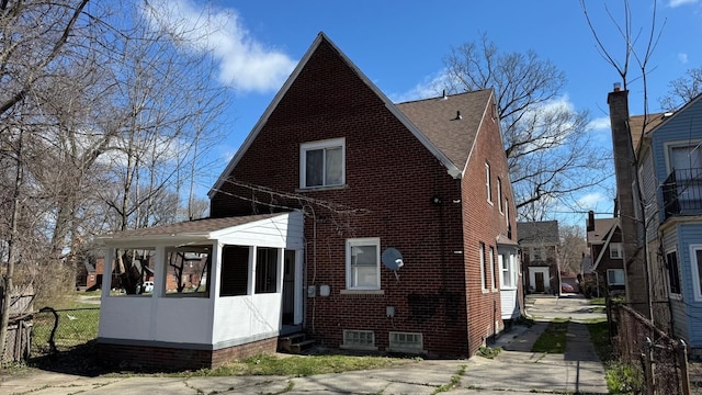 5051 Courville St, Detroit, MI 48224 - back of property featuring fence and entry steps