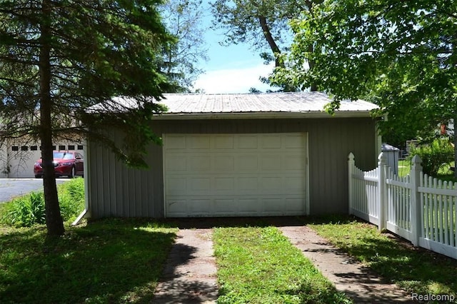 702 Oda St, Davison, MI 48423 - detached garage featuring fence