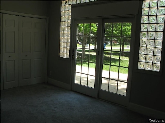 702 Oda St, Davison, MI 48423 - doorway to outside with carpet floors