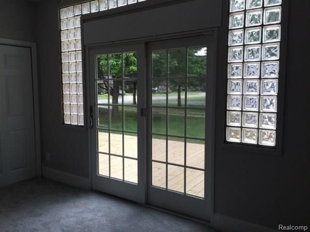 702 Oda St, Davison, MI 48423 - doorway with carpet flooring