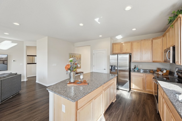 kitchen featuring light brown cabinets, open floor plan, stainless steel appliances, dark wood finished floors, and recessed lighting