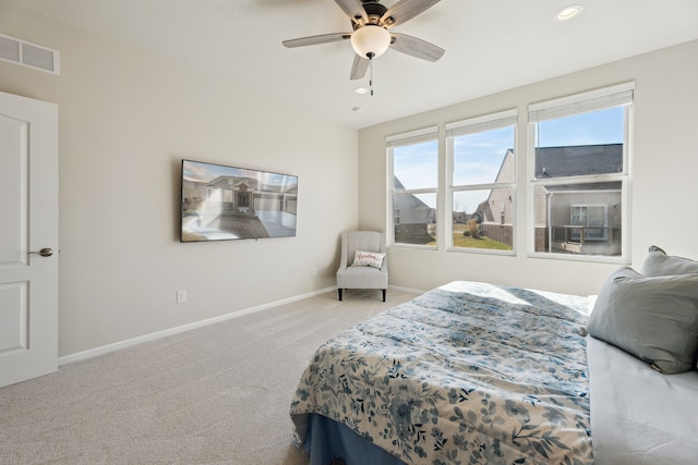 carpeted bedroom with ceiling fan, baseboards, visible vents, and recessed lighting