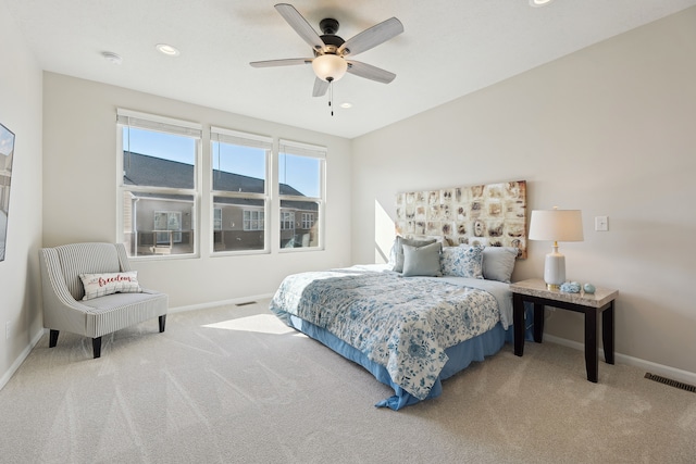 carpeted bedroom featuring recessed lighting, visible vents, and baseboards