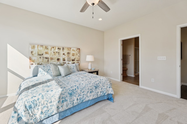 bedroom featuring baseboards, recessed lighting, a ceiling fan, ensuite bath, and carpet floors