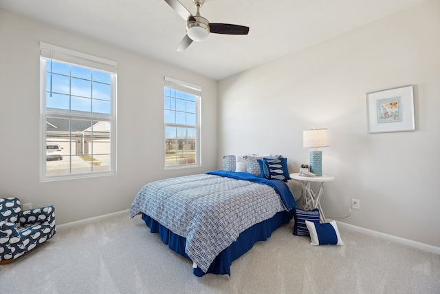 bedroom featuring carpet flooring, baseboards, and ceiling fan
