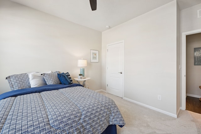 bedroom featuring light colored carpet, ceiling fan, baseboards, and visible vents