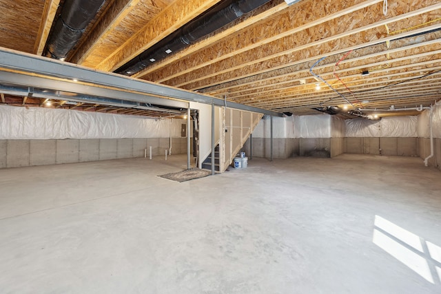 unfinished basement with stairway