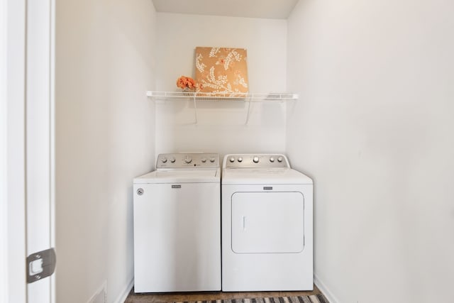 clothes washing area with laundry area and independent washer and dryer