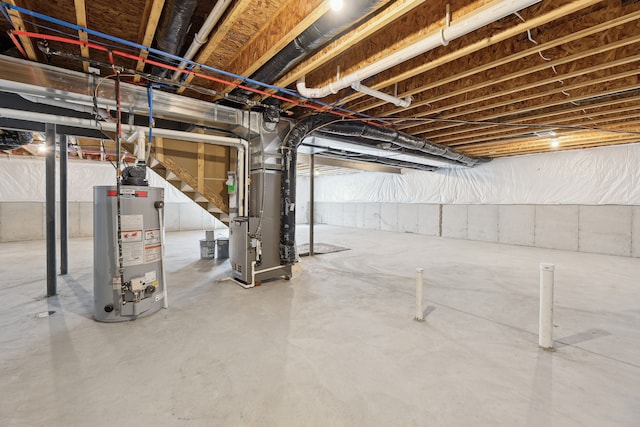 unfinished below grade area featuring heating unit and water heater