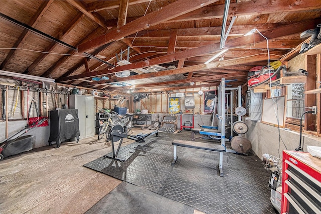 workout room with lofted ceiling
