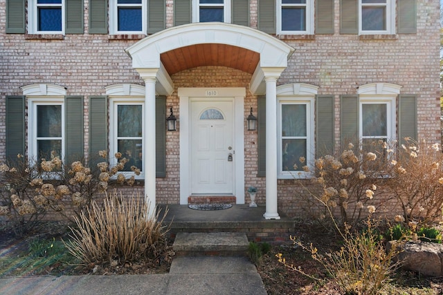 entrance to property with brick siding