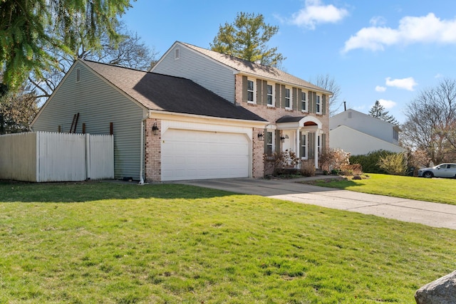 view of front facade with a garage, concrete driveway, fence, a front yard, and brick siding