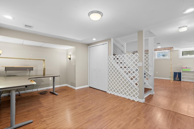 interior space with stairway, wood finished floors, baseboards, visible vents, and recessed lighting
