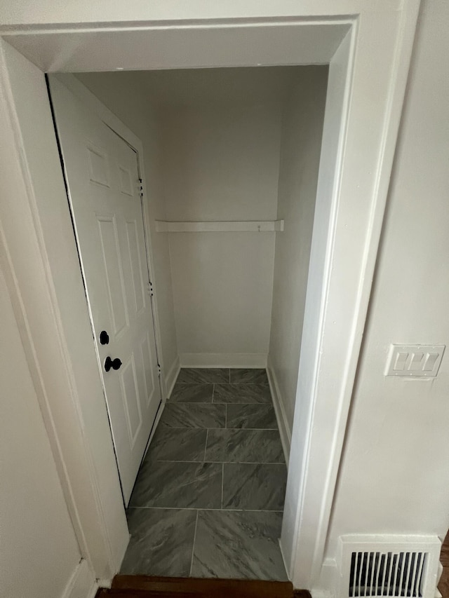 interior space featuring marble finish floor and visible vents