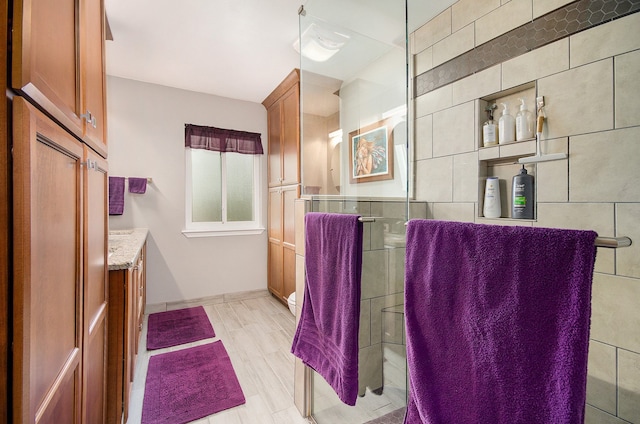 bathroom featuring vanity and baseboards