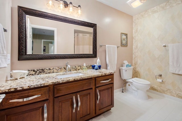 full bath featuring toilet, baseboards, tile patterned flooring, and vanity