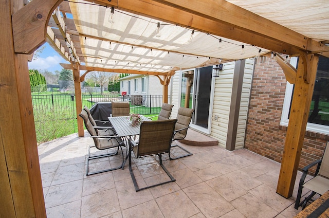 view of patio / terrace with a pergola, fence, and outdoor dining space
