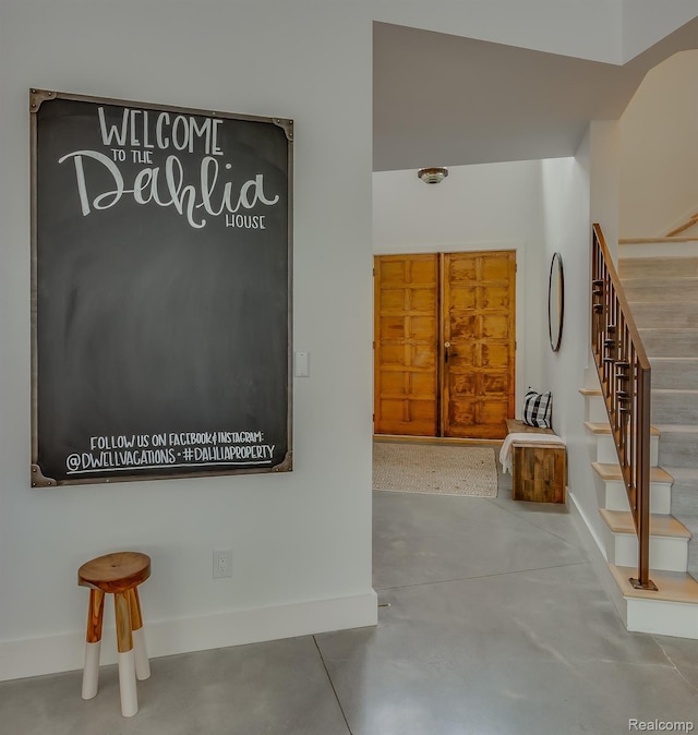 10630 Garr Rd, Berrien Springs, MI 49103 - entryway with stairway and concrete floors