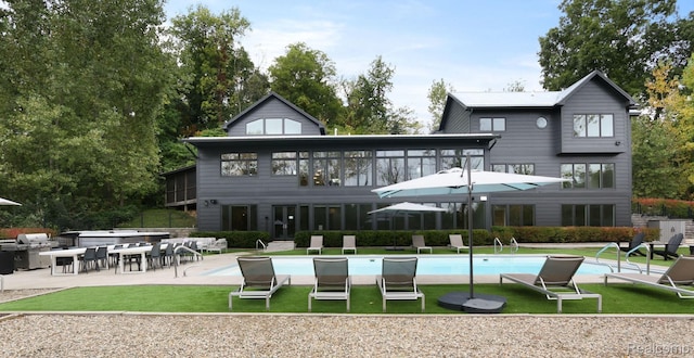 10630 Garr Rd, Berrien Springs, MI 49103 - back of house featuring a patio, an outdoor pool, and a yard