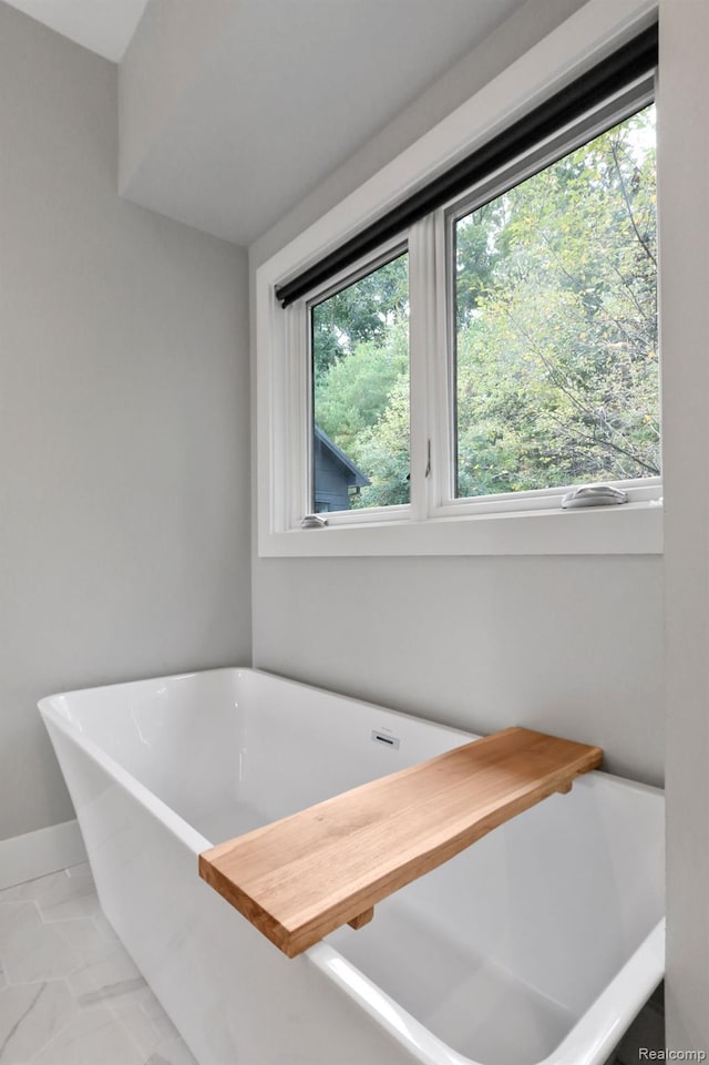 10630 Garr Rd, Berrien Springs, MI 49103 - bathroom featuring a freestanding bath and marble finish floors