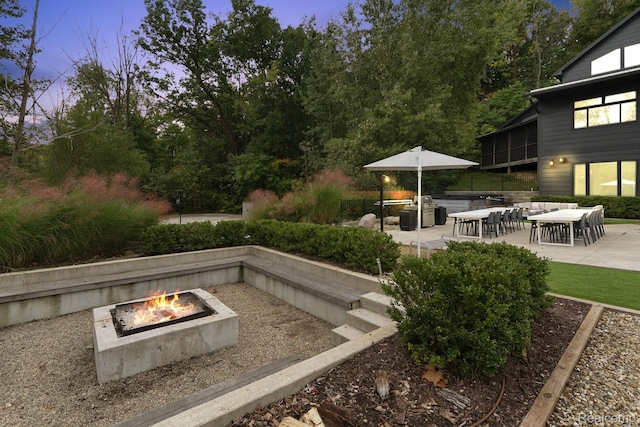 10630 Garr Rd, Berrien Springs, MI 49103 - view of yard featuring an outdoor fire pit and a patio area