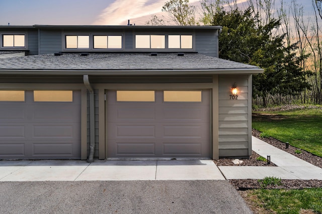 garage with aphalt driveway