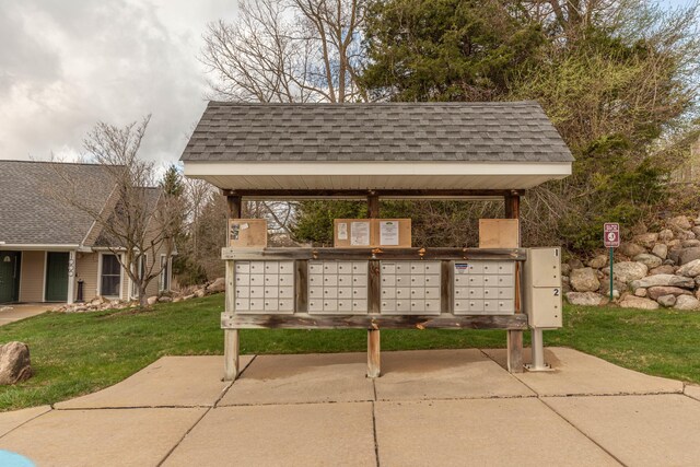 1005 E Duncan St Unit 2D, Manchester, MI 48158 - surrounding community with mail area and a lawn