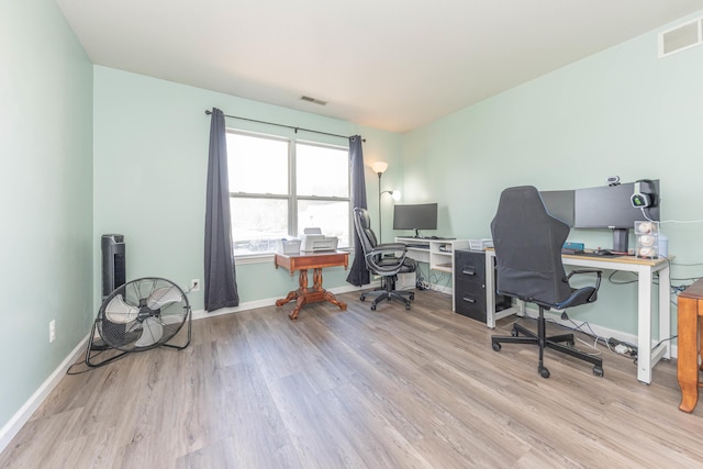 1005 E Duncan St Unit 2D, Manchester, MI 48158 - office space featuring wood finished floors, visible vents, and baseboards